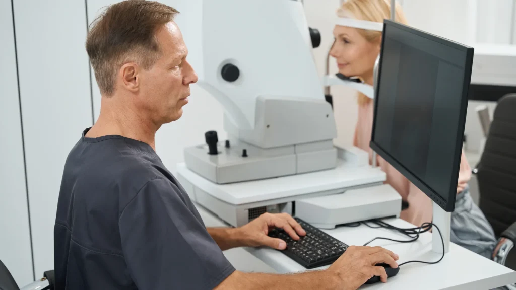 Eye doctor for glaucoma examining a patient’s optic nerve for diagnosis and treatment.